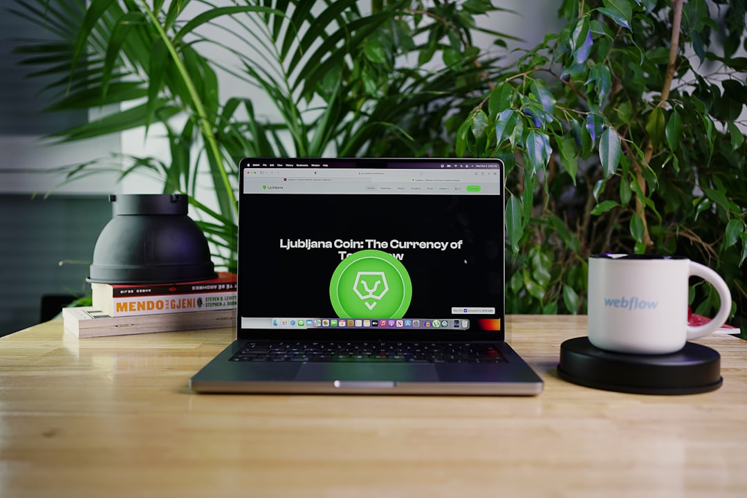 a-laptop-computer-sitting-on-top-of-a-wooden-desk-tu2dqsy8vuc